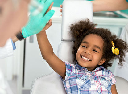 Pediatric Dentist with Kid Patient